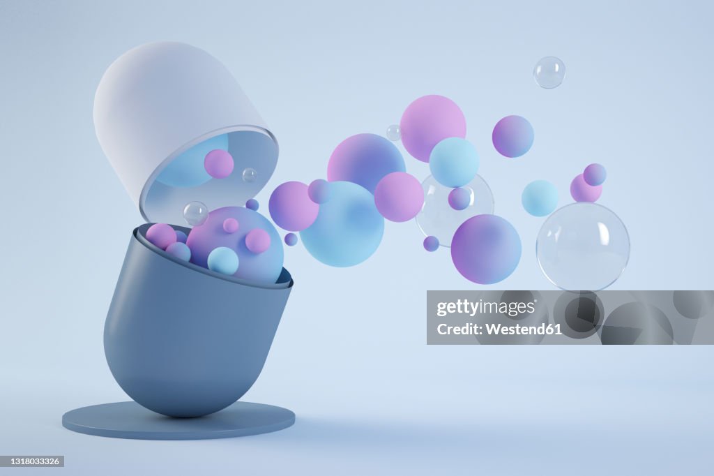 Three dimensional render of various bubbles floating out of opened capsule