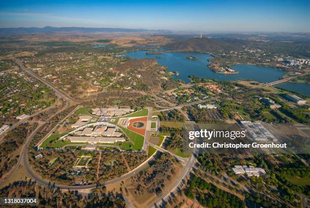 aerial view of parliament house and lake burley griffin, canberra - canberra nature stock pictures, royalty-free photos & images