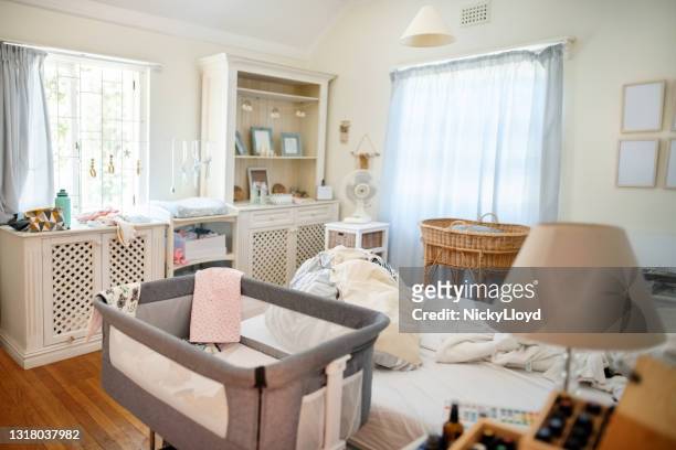 lived in bedroom of a family with a baby - family chaos stock pictures, royalty-free photos & images