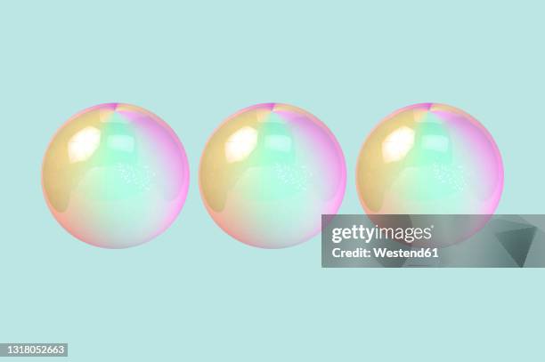 three dimensional render of three bubbles against green background - soap bubble transparent stock illustrations