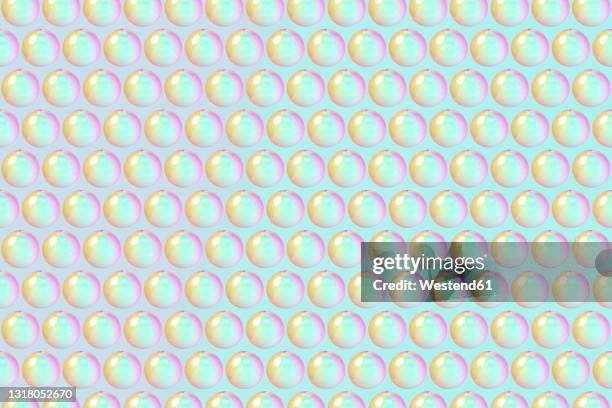 three dimensional pattern of rows of bubbles against green background - visible light spectrum stock illustrations