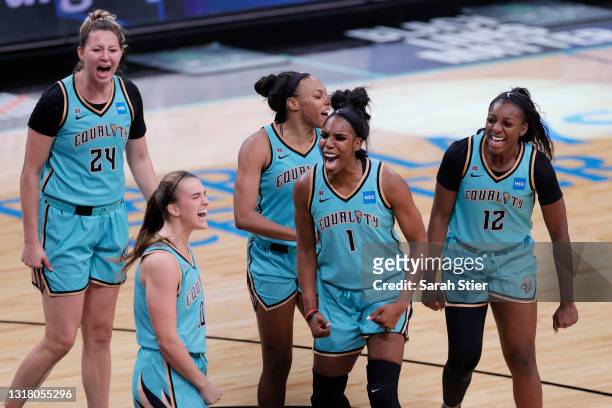 The New York Liberty celebrate after Sabrina Ionescu made a three-point basket in the final seconds of the second half against the Indiana Fever at...