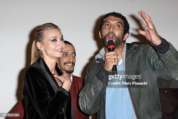 Ramzy Bedia and Anca Radici attend the 'Halal Police d'etat' premiere at UGC Cine Cite Bercy on February 15, 2011 in Paris, France.