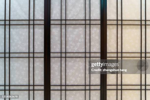 full frame view of window with traditional wooden grids. - chinese window pattern stockfoto's en -beelden