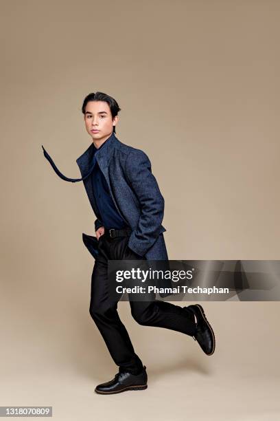 fashionable young man - suave stock pictures, royalty-free photos & images