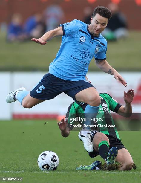 Alex Baumjohann of Sydney FC is challenged by Braddan Inmann of Western United during the A-League match between Western United and Sydney FC at Mars...