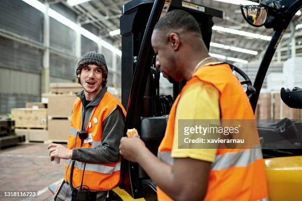warehouse workers taking a break for lunch - coworker lunch stock pictures, royalty-free photos & images