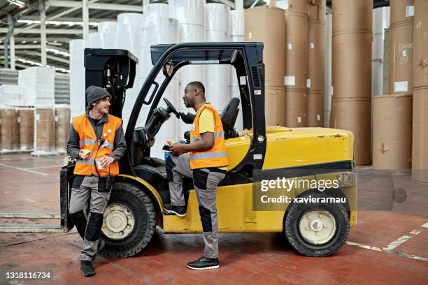 warehousemen relaxing and eating lunch - ware house worker forklift stock pictures, royalty-free photos & images