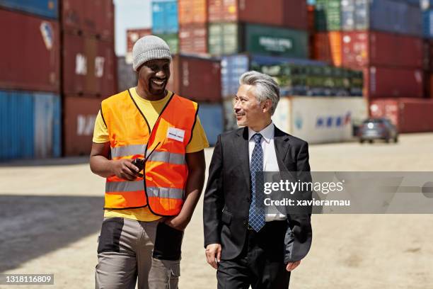 distribution manager and cargo handler at inland port - reflective clothing stock pictures, royalty-free photos & images