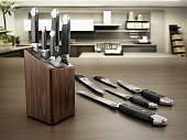 Set of kitchen knives standing on the table