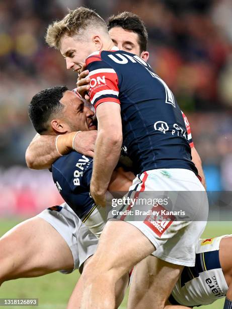 Valentine Holmes of the Cowboys is wrapped up by the defence during the round 10 NRL match between the Sydney Roosters and the North Queensland...