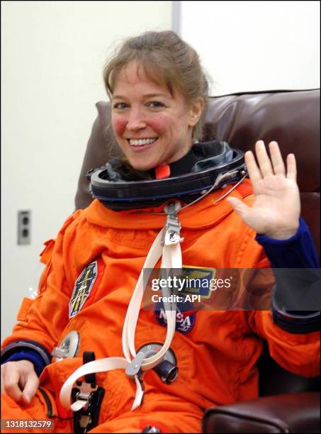 Mission Specialist Lisa Nowak shows she is happy and excited to be preparing for launch with the fitting of her launch and entry suit. Nowak is...