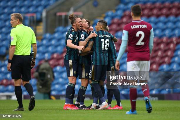 Mateusz Klich of Leeds United celebrates with team mates Luke Ayling, Kalvin Phillips and Raphinha after scoring their side's first goal during the...