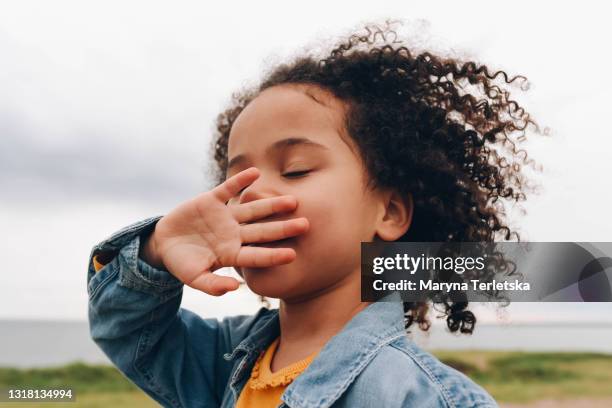 portrait of a smiling dark curly-haired girl. - black girls fotografías e imágenes de stock