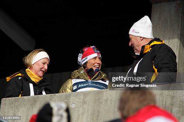 Marit Bjoergen celebrates with Queen Sonja of Norway and King Harald V of Norway after winning the gold medal in the FIS Nordic World Ski...