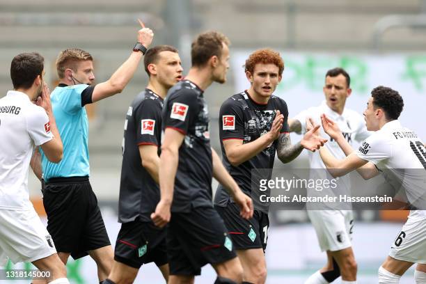 Ruben Vargas of FC Augsburg is shown a red card during the Bundesliga match between FC Augsburg and SV Werder Bremen at WWK-Arena on May 15, 2021 in...