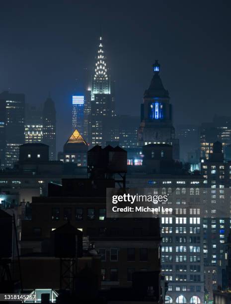 foggy view of chrysler building and midtown manhattan - new york vacation rooftop stock pictures, royalty-free photos & images