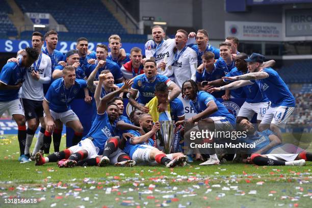 Rangers players celebrate with the Scottish Premiership trophy following the Scottish Premiership match between Rangers and Aberdeen on May 15, 2021...