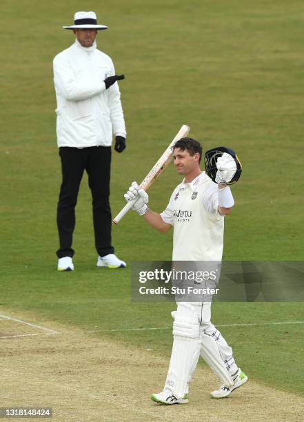 Durham batsman Will Young celebrates after reaching his century as umpire Michael Gough signals four runs during Day three of the LV= Insurance...