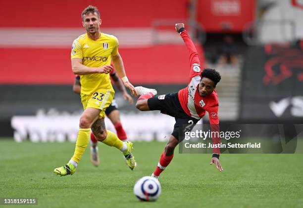 Joe Bryan of Fulham and Kyle Walker-Peters of Southampton look on as the ball travels away from them during the Premier League match between...