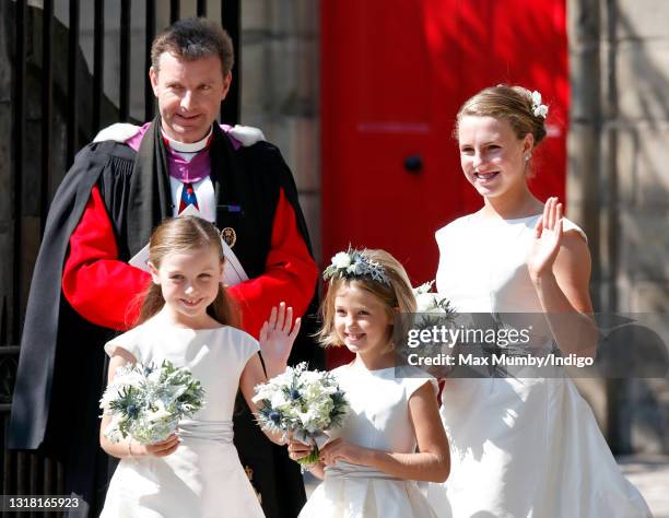 Reverend Neil Gardner, Minister of Canongate Kirk looks on as Stephanie Phillips , half sister of Zara Phillips, attends the wedding of Zara Phillips...