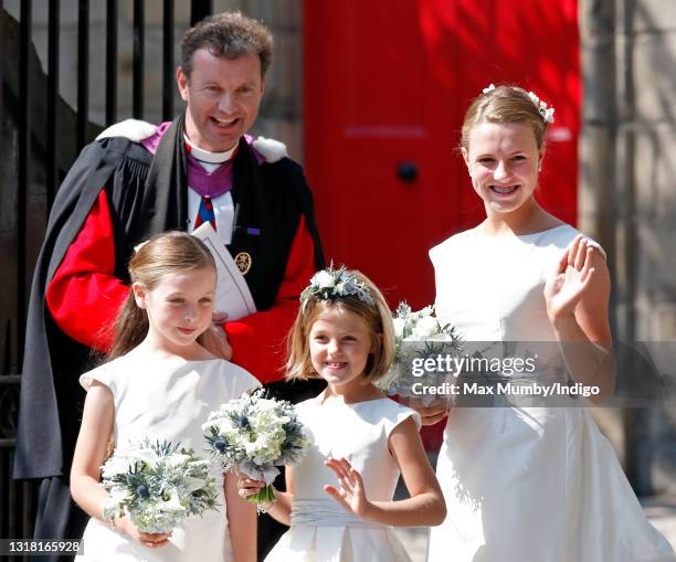 Reverend Neil Gardner, Minister of Canongate Kirk looks on as Stephanie Phillips , half sister of Zara Phillips, attends the wedding of Zara Phillips...