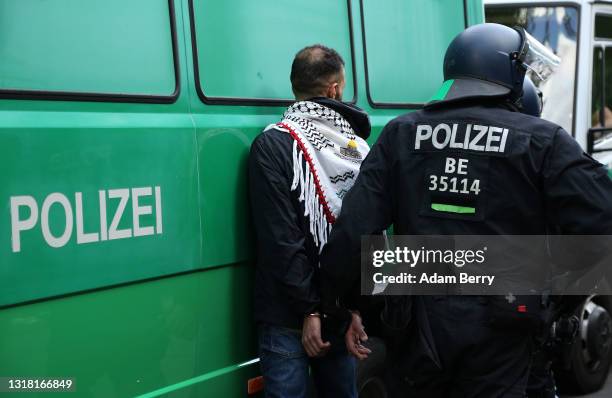 Police arrest a protester during a march on Al Nakba Day to demonstrate for the rights of Palestinians on May 15, 2021 in Berlin, Germany. This...