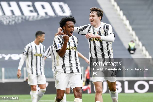 Juan Cuadrado of Juventus celebrates after scoring his team's second goal with teammate Federico Chiesa during the Serie A match between Juventus and...