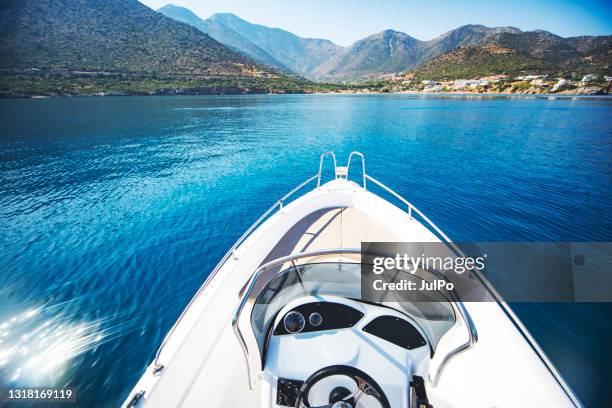 speedboat traveling over blue sea - speed boat stock pictures, royalty-free photos & images