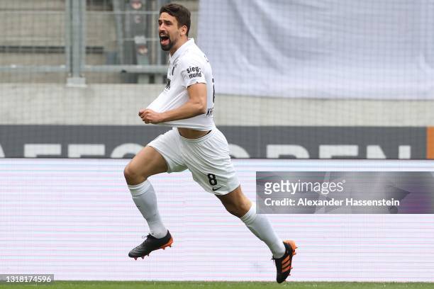 Rani Khedira of FC Augsburg celebrates after scoring their side's first goal during the Bundesliga match between FC Augsburg and SV Werder Bremen at...