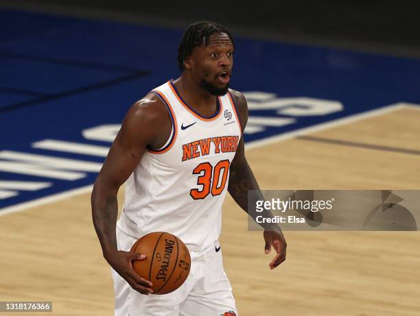 Julius Randle of the New York Knicks directs his teammates in the second quarter against the Charlotte Hornets at Madison Square Garden on May 15,...