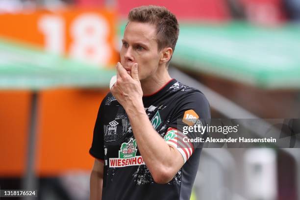 Niklas Moisander of SV Werder Bremen looks dejected following the Bundesliga match between FC Augsburg and SV Werder Bremen at WWK-Arena on May 15,...