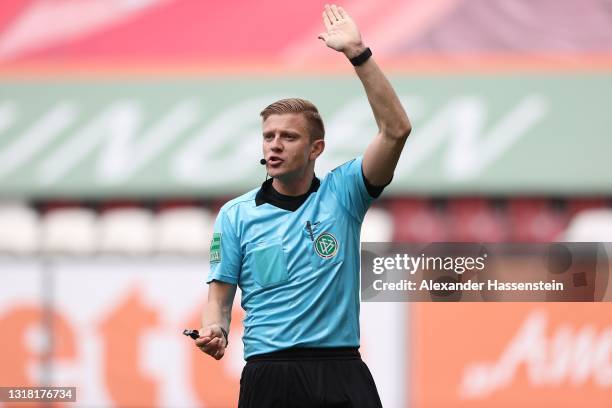 Referee Robert Schröder reacts during the Bundesliga match between FC Augsburg and SV Werder Bremen at WWK-Arena on May 15, 2021 in Augsburg,...