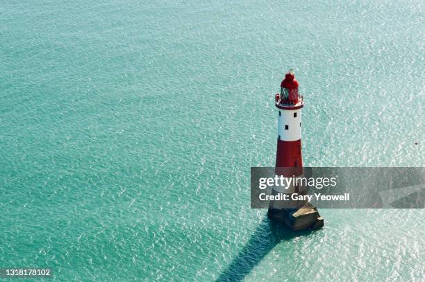looking out over the sea at beachy head - lighthouse fotografías e imágenes de stock