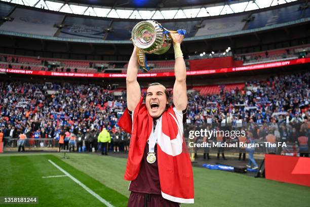 Caglar Soyuncu of Leicester City lifts the Emirates FA Cup trophy following The Emirates FA Cup Final match between Chelsea and Leicester City at...