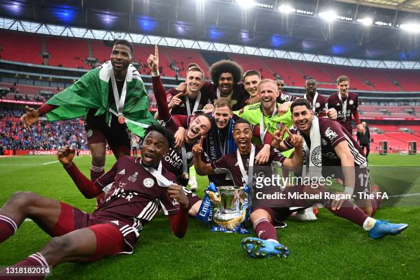 Leicester City players celebrate with the Emirates FA Cup trophy following The Emirates FA Cup Final match between Chelsea and Leicester City at...