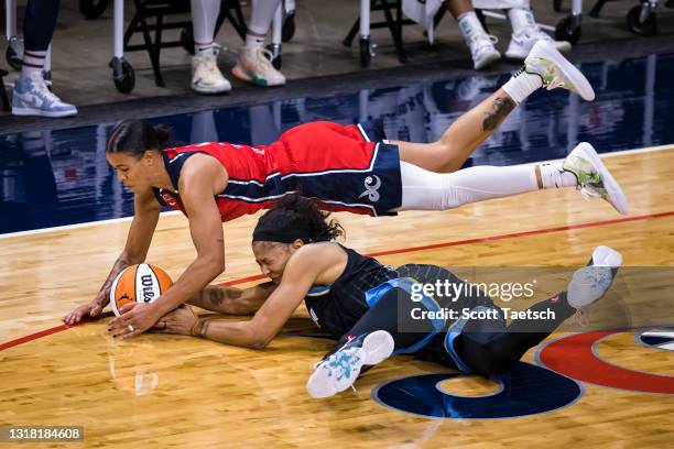 Natasha Cloud of the Washington Mystics and Candace Parker of the Chicago Sky dive for a loose ball during the second half at Entertainment & Sports...