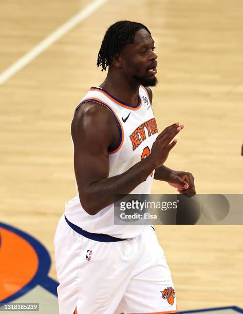 Julius Randle of the New York Knicks celebrates late in overtime against the Charlotte Hornets at Madison Square Garden on May 15, 2021 in New York...