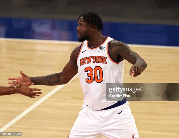 Julius Randle of the New York Knicks celebrates late in overtime after he fed the ball to Alec Burks and he shot a three pointer against the...