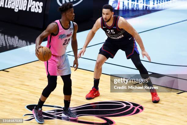 Ben Simmons of the Philadelphia 76ers defends Jimmy Butler of the Miami Heat during the first quarter at American Airlines Arena on May 13, 2021 in...