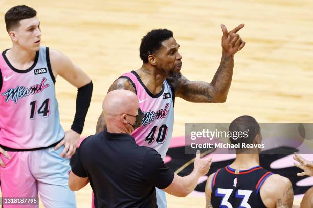 Udonis Haslem of the Miami Heat is held back by Kendrick Nunn and team security after a scuffle with Dwight Howard of the Philadelphia 76ers during...