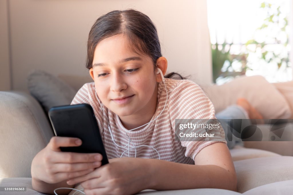Girl Getting A Message Teenager Girl Looks At Messages On Social Media High-Res Stock Photo ...