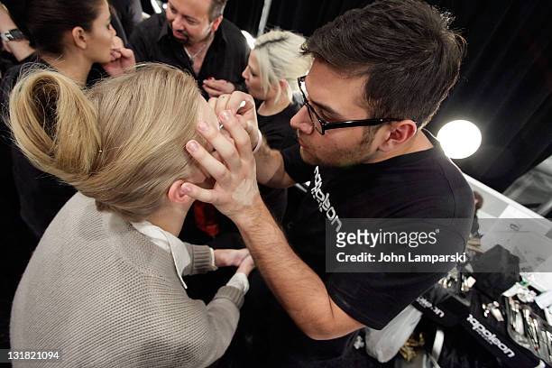 Models prepare backstage for the Venexiana Fall 2011 presentation during Mercedes-Benz Fashion Week at The Studio at Lincoln Center on February 11,...