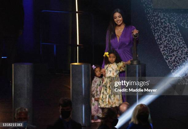 Vanessa Bryant stands with daughters Capri and Bianka after speaking on behalf of Class of 2020 inductee, Kobe Bryant during the 2021 Basketball Hall...