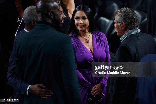 Vanessa Bryant talks with University of Connecticut Huskies women's basketball head coach, Geno Auriemma before the 2021 Basketball Hall of Fame...