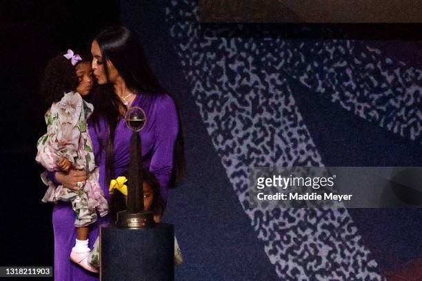 Vanessa Bryant holds her daughter Capri following the 2021 Basketball Hall of Fame Enshrinement Ceremony at Mohegan Sun Arena on May 15, 2021 in...