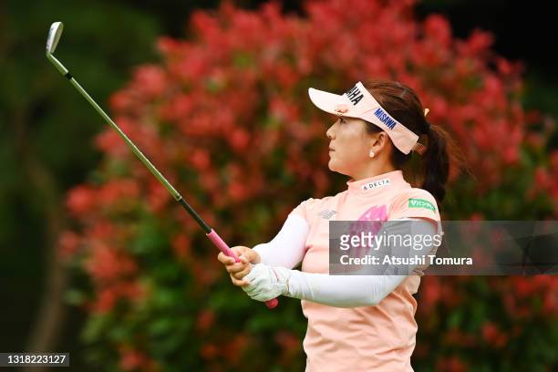 Chie Arimura of Japan hits her second shot on the 13th hole during the rest of second round of the Hoken no Madoguchi Ladies at the Fukuoka Country...