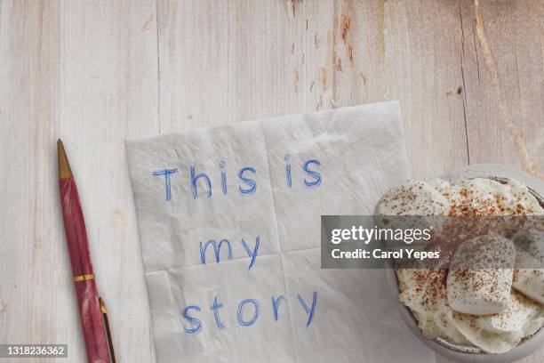 this is my story message on paper napkin with coffee - storytelling recomendation stock-fotos und bilder