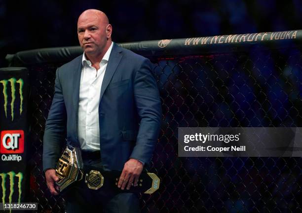 President Dana White waits to place the UFC lightweight championship belt on Charles Oliveira of Brazil after defeating Michael Chandler in their...
