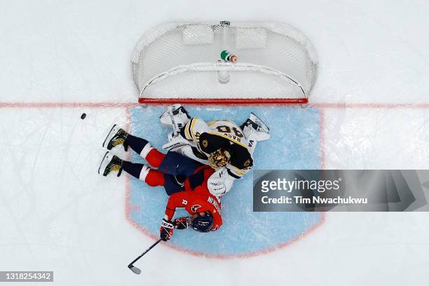 Alex Ovechkin of the Washington Capitals slides into Tuukka Rask of the Boston Bruins during the third period during Game One of the First Round of...